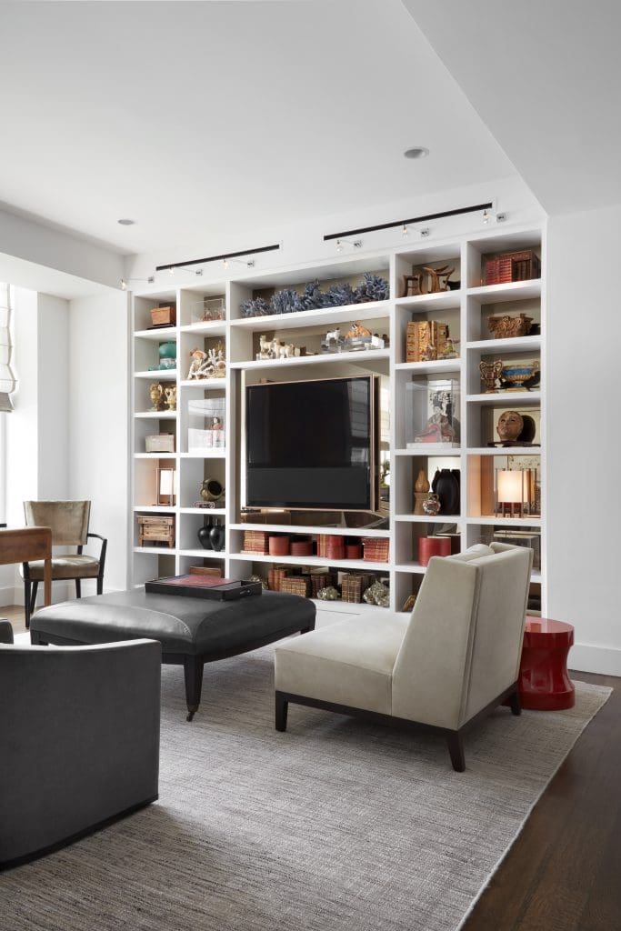 In the living room, a Cameron Lombard chair upholstered in Cameron velvet, and Wilson Cameron ottoman, upholstered in Rogers & Goffigon leather, all from George Cameron Nash. Christian Liaigre suede chair from David Sutherland. Holly Hunt lacquer table. Edward Fields rug.