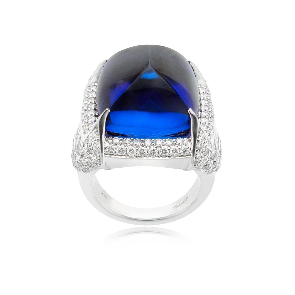 William Noble Tanzanite Ring: 18K white gold, tanzanite, and diamond ring with a 30-carat sugar loaf tanzanite accented with 3 carats of diamonds