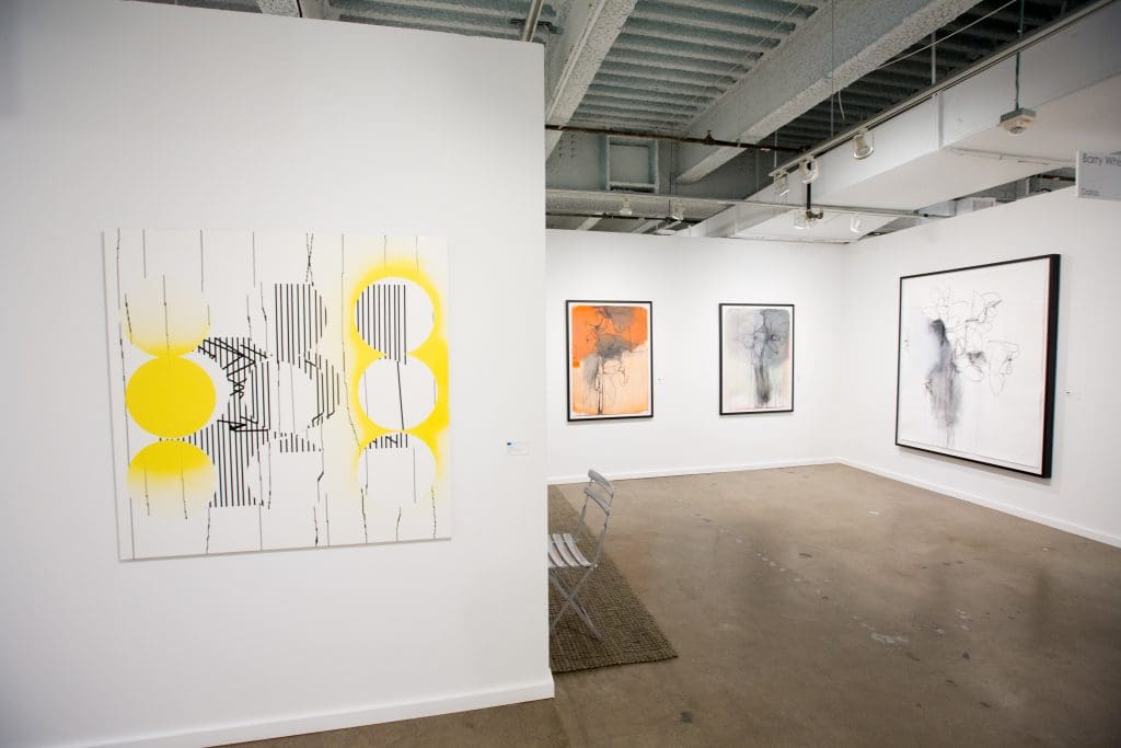 Dallas stalwart Barry Whistler devoted his booth to a trio: John Pomara (foreground), Andrea Rosenberg, and Jay Shinn. (Photo Allison v. Smith) 