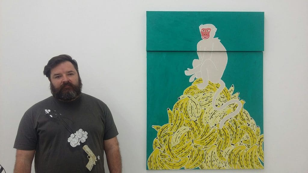 Design District dealer Brian Gibb with a canvas by Manik Raj Nakra. Nakra's work sold, part of the rising tide that positively impacted even galleries that did not exhibit in the Fair. 