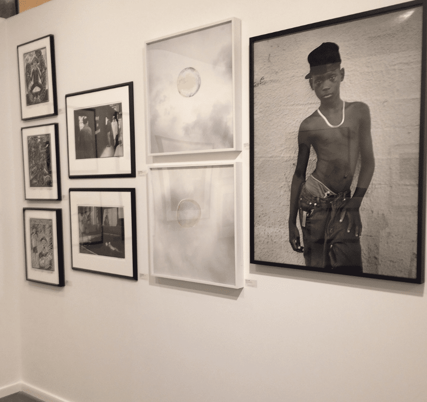 Dallas-based PDNB Gallery returned to the Fair after a hiatus of five years, and reported keen response its photo platform. On the right, Earlier Hudnall Jr.'s "Hip Hop" is on hold for a Texas museum. 