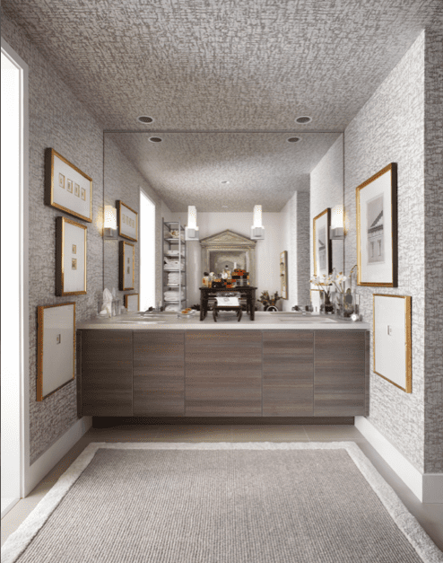 Poggenpohl cabinetry and fixtures in the master bath. Collection of antique French
etchings. Antique Chinese trays hold Hermès cologne. Zimmer+Rohde wall covering, from George Cameron Nash. Rug from Interior Resources.