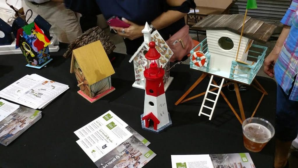 A bevy of birdhouses on the block raise green for the Houston Arboretum & Nature Center. 