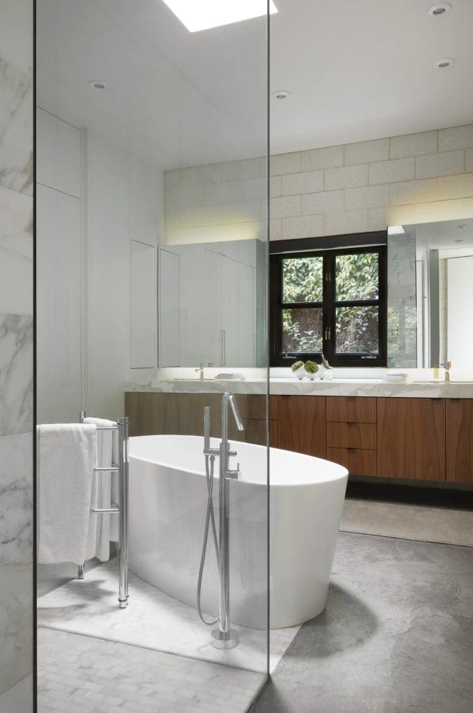 James Ferrara designed the master bath, which includes walnut and Calacatta gold cabinets, Wetstyle tub, Aquabrass faucets, and a Dornbracht towel rack.
