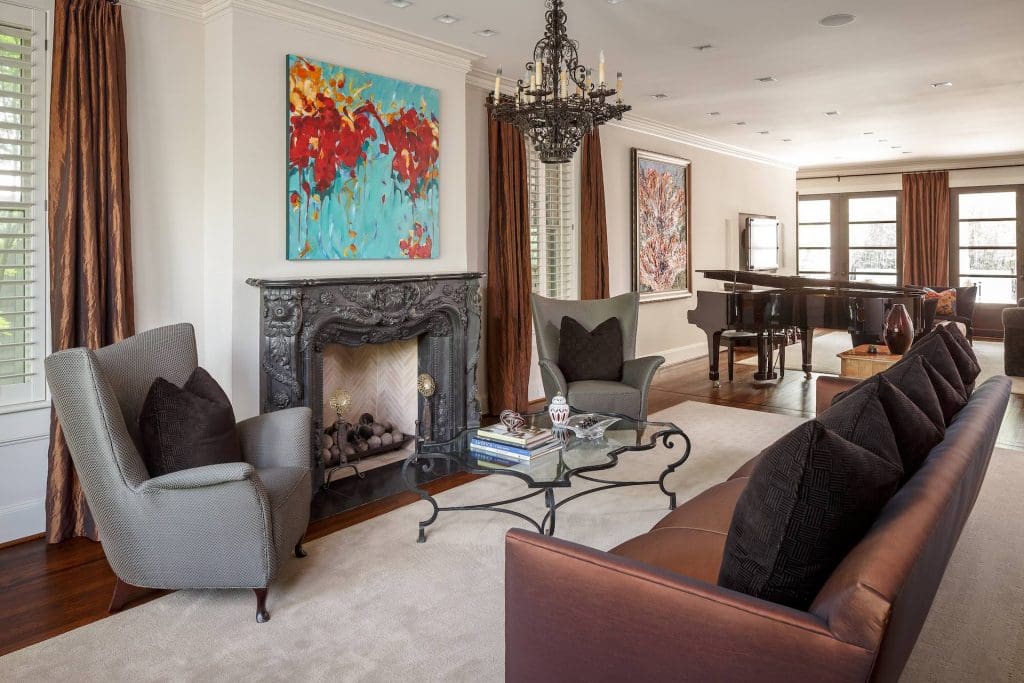 The formal living area features an ornate fireplace. 