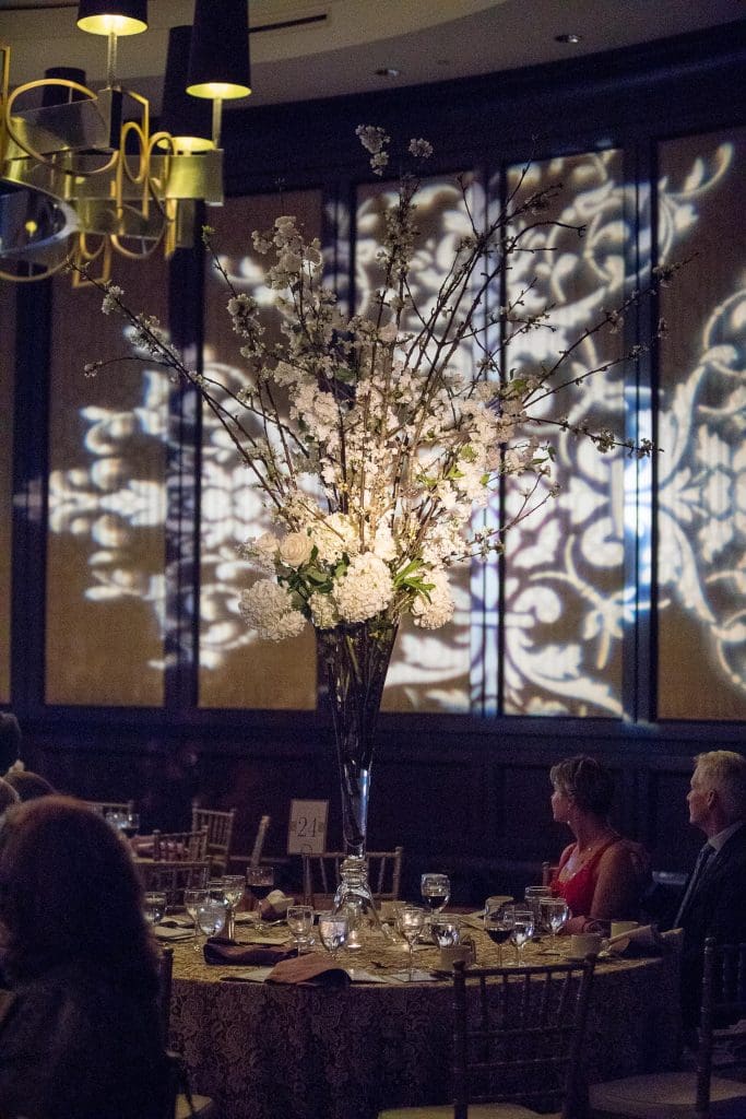 A three-course dinner is served in the Stemmons Ballroom.