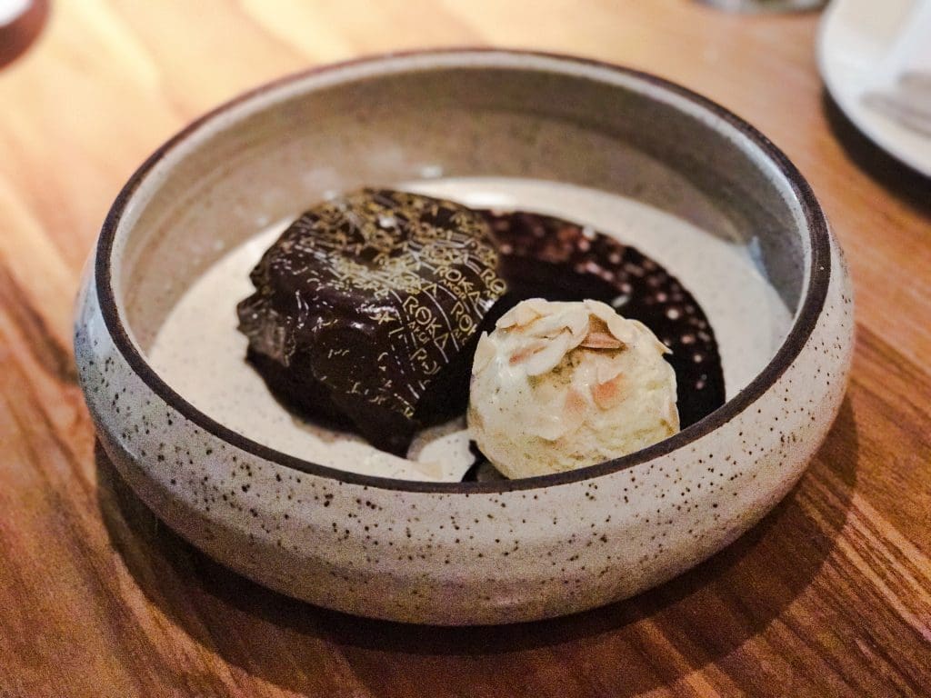 End your meal with a sweet treat like Roka Akor's warm Valhrona chocolate cake with almond caramel and vanilla ice cream. 