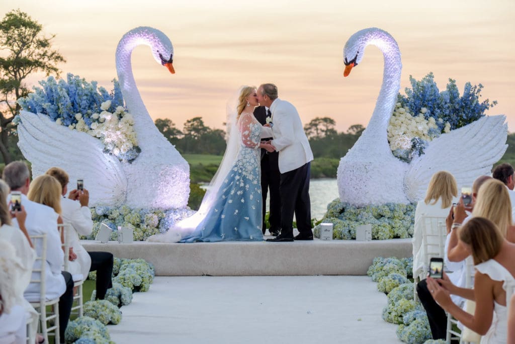 Jim Crane and Whitney Wheeler seal their marriage with a kiss.