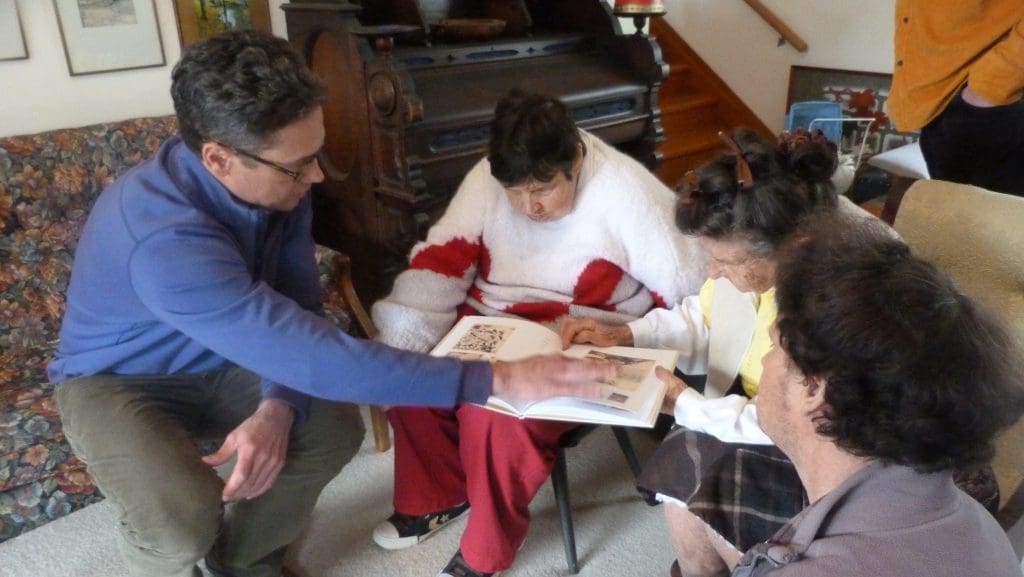 Chris Byrne and Susan Te Kahurangi King in Auckland, New Zealand, Winter 2014. Byrne shows the artist her first monograph. Independent curator Byrne, co-founder of the Dallas Art Fair, has been a champion of King's work.