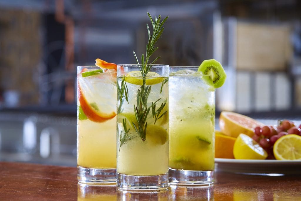 Cocktails from left to right: Bell Pepper Rickey, Rosemary Fusion, Kiwi Caipirinha