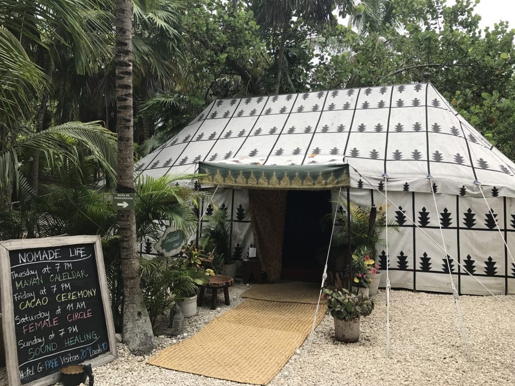 The "Gratitude Tent" at Nomade offers daily programs like cacao ceremonies, sound healing, and more. 
