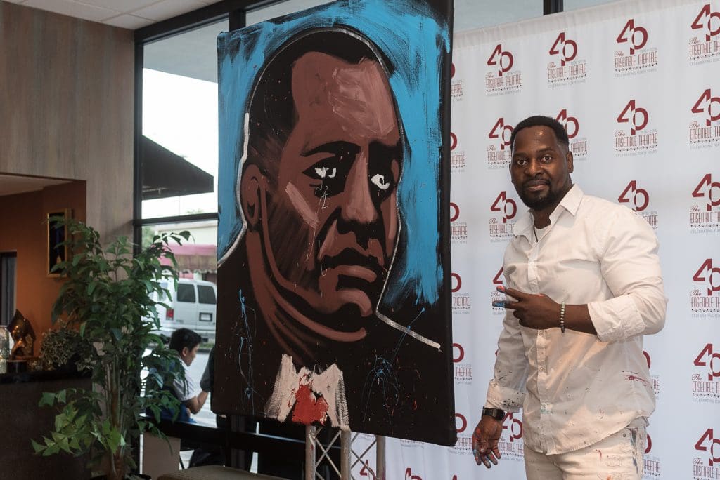Ange Hillz entertained the crowd by painting a portrait of Rick Smith on the spot. 