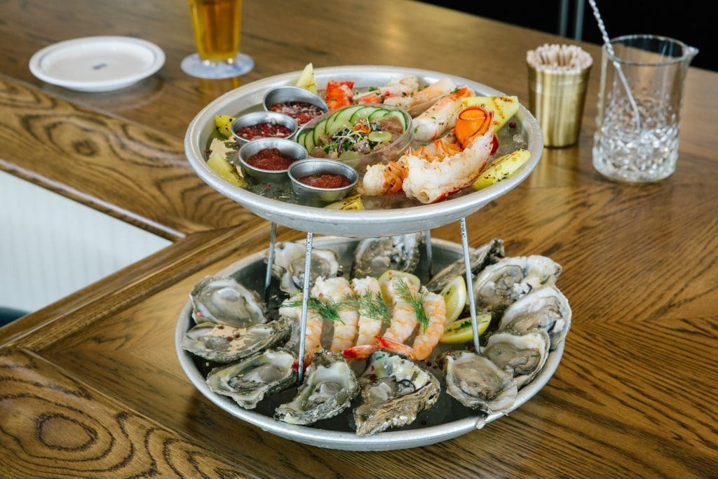 For $90, "The Royal" tower offers a sampling of each item on the raw bar menu - along with a poached lobster tail  (Photo by Kelsey Foster)