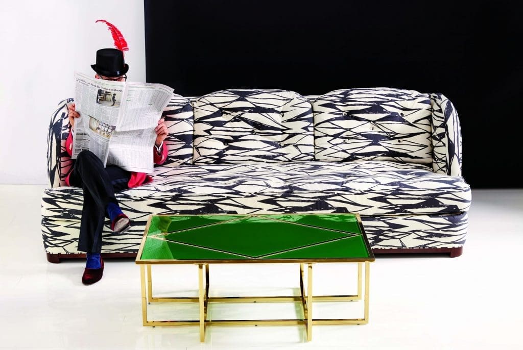 Miles Redd perched atop the Samuel sofa, accented with the Diamond coffee table