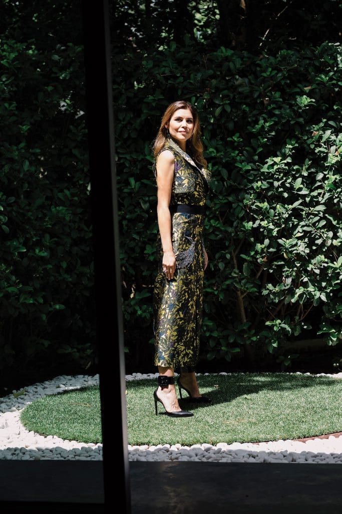 Cockrell in an Erdem sleeveless coat $3,210, at Forty Five Ten. 