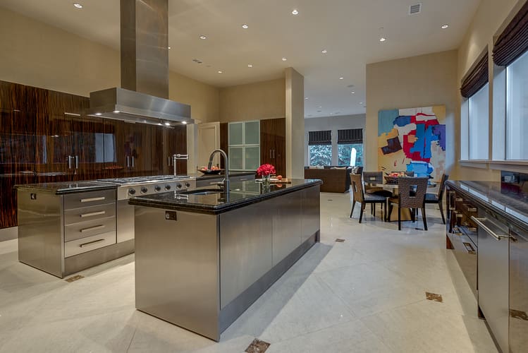 The gourmet chef's kitchen has rare ebony cabinets. 