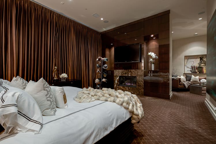 The master suite includes a sitting area and fireplace. 