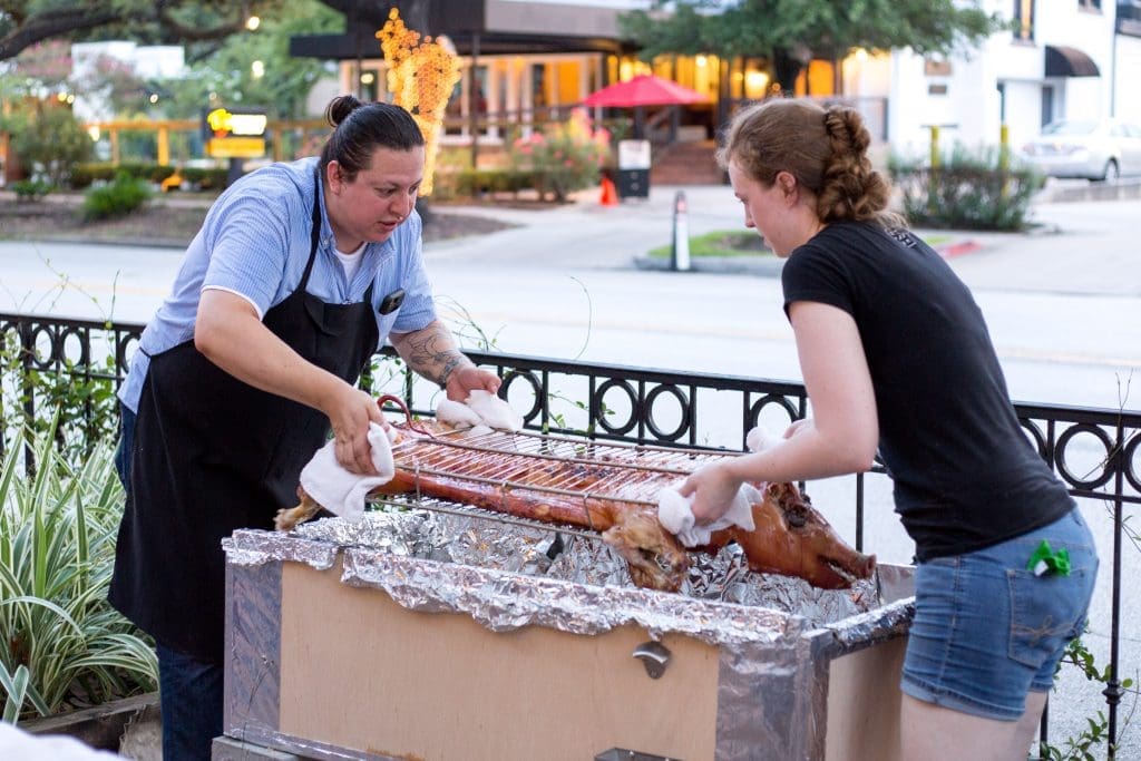 Edgar Hernandez and Martha De Leon flip the pig. 