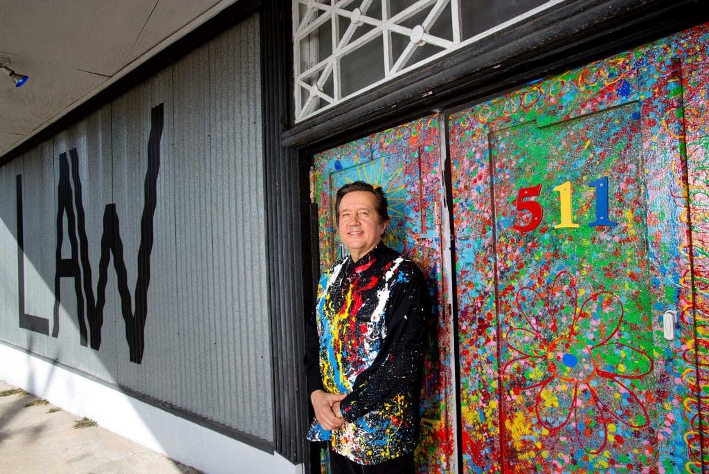 Randall Kallinen, Civil Rights attorney and artist, in front of his gallery, law office, and home, Kallinen Contemporary. (Photo by Thomas B. Shea)