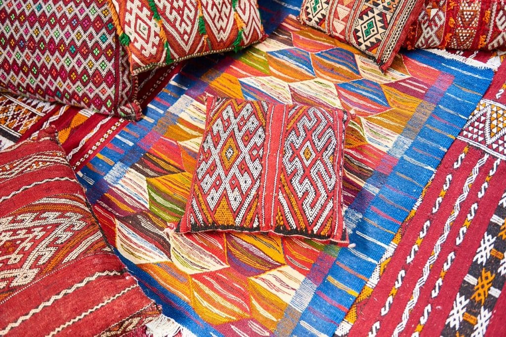 The collection will include one-of-a-kind vintage rugs and pillows. 