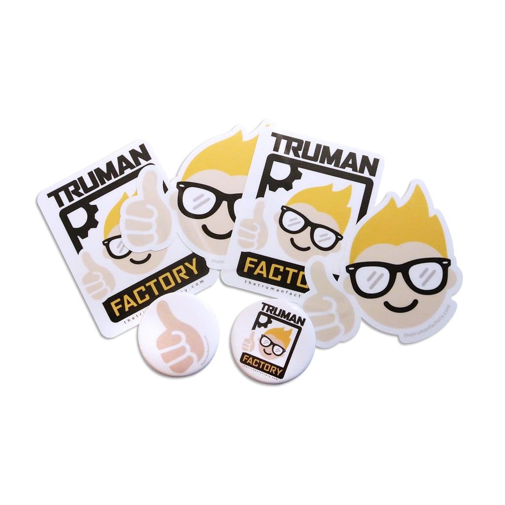 The Truman Factory sells buttons, stickers and T-shirts with the logo. 