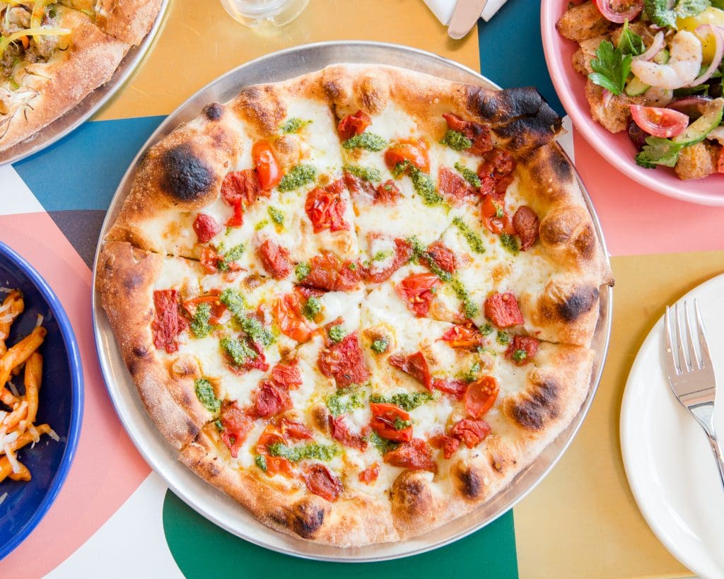 Tomato, basil pesto, mozzarella pizza at Sassetta in Dallas. Photography by Mei-Chun Jau.