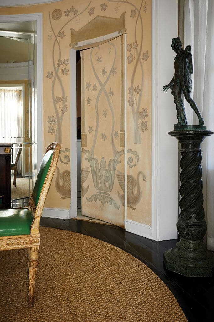 In the circular dining room, a jib door leads to the kitchen.