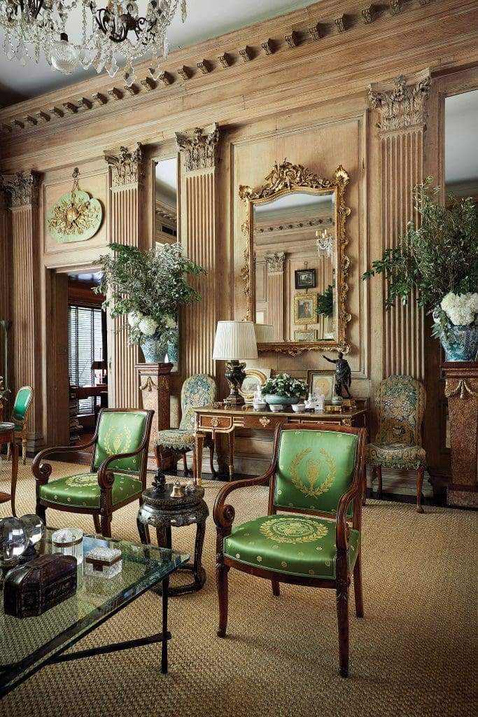 The 300-year old oak drawing room from Wingerworth Hall is 16 feet tall. English gilt 1865 mirror. Period Queen Ann chairs with original tapestry. Regency-style chairs from 19th century, covered in green Brunschwig Silk. 