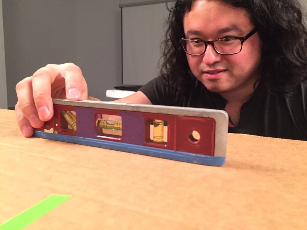 Recording my residence exhibition for posterity: Artpace archives associate Chris Castillo setting up the photo stand for documenting multiple works-on-paper.