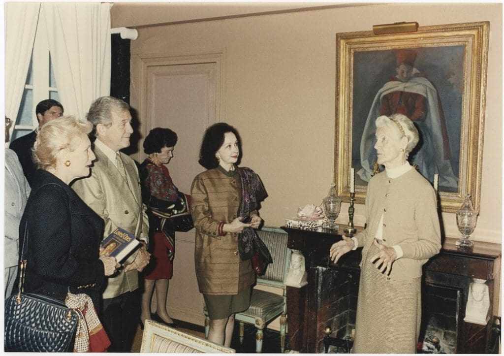 Betty Gertz, Joe Minton, and Nita Carrol Cervin listen to Diana Mitford (a.k.a. Lady Mosely) talk inside her house outside Paris, circa 1990.
