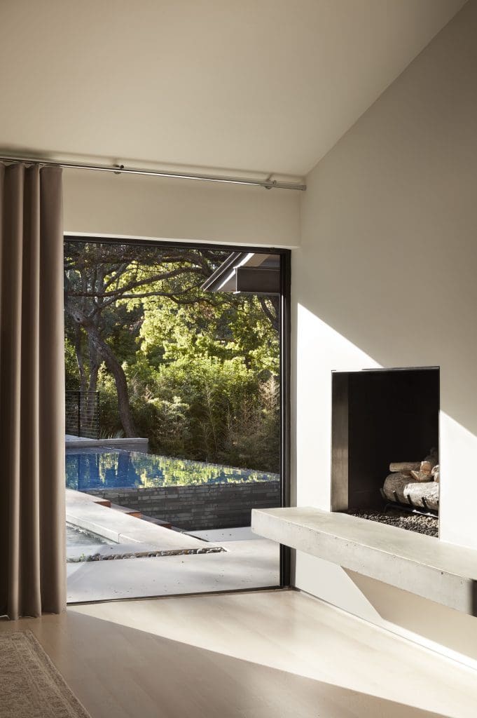 The master bedroom overlooks the infinity pool. Custom Bergamo drapery by R Brant Design. 