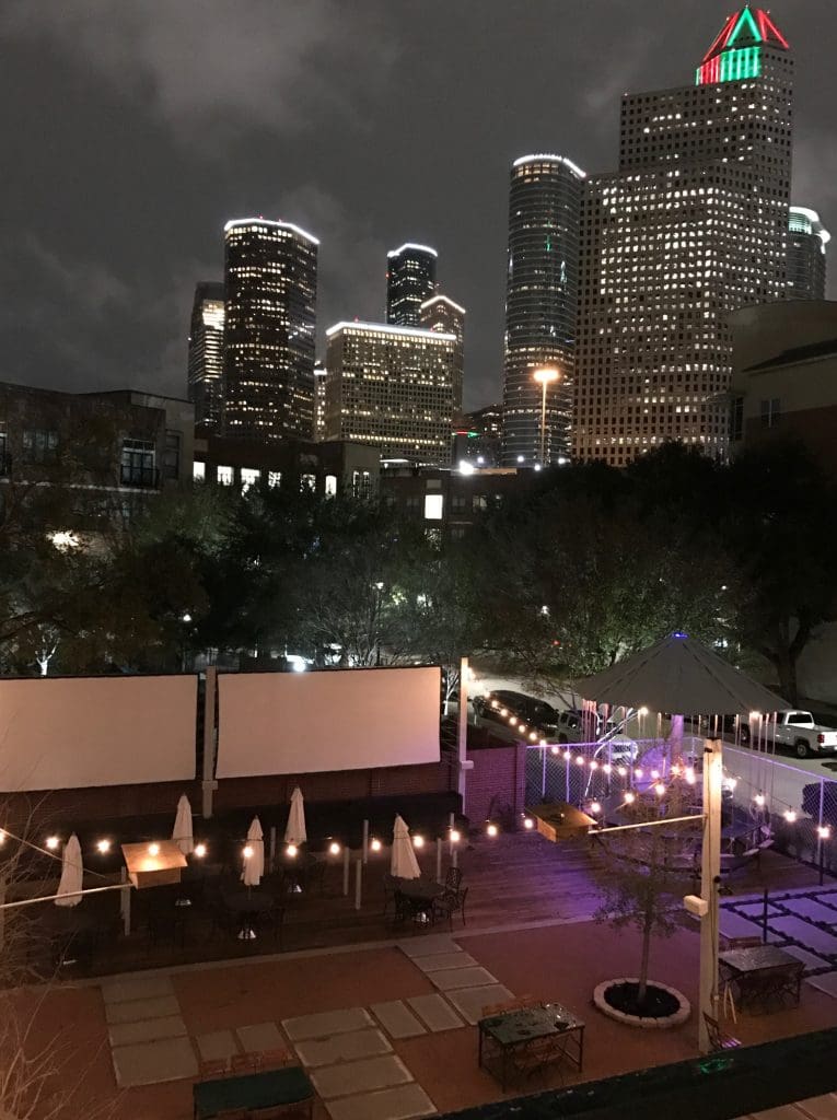 The Houston skyline stands out behind the patio's projectors. 