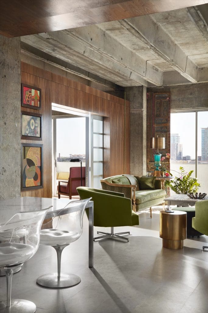 Custom walnut wall designed by Bentley Tibbs. Brass end table from Target. LaVerne chairs with original leather seats and marble Parsons table, both circa 1970.
