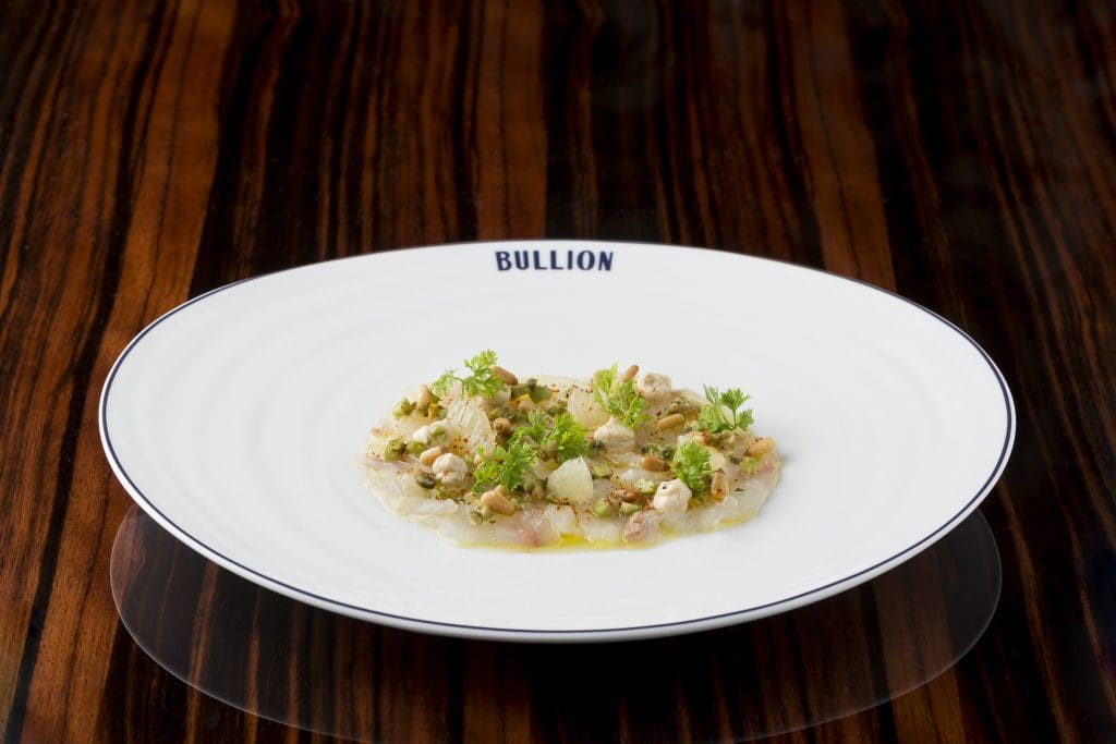 Fluke Crudo (green olive, pinenut cream, preserved lemon) at Bullion