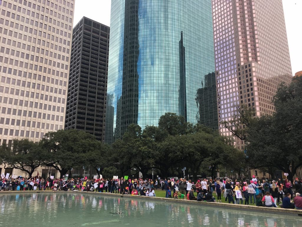 Marchers thronged the City Hall reflection pool. 