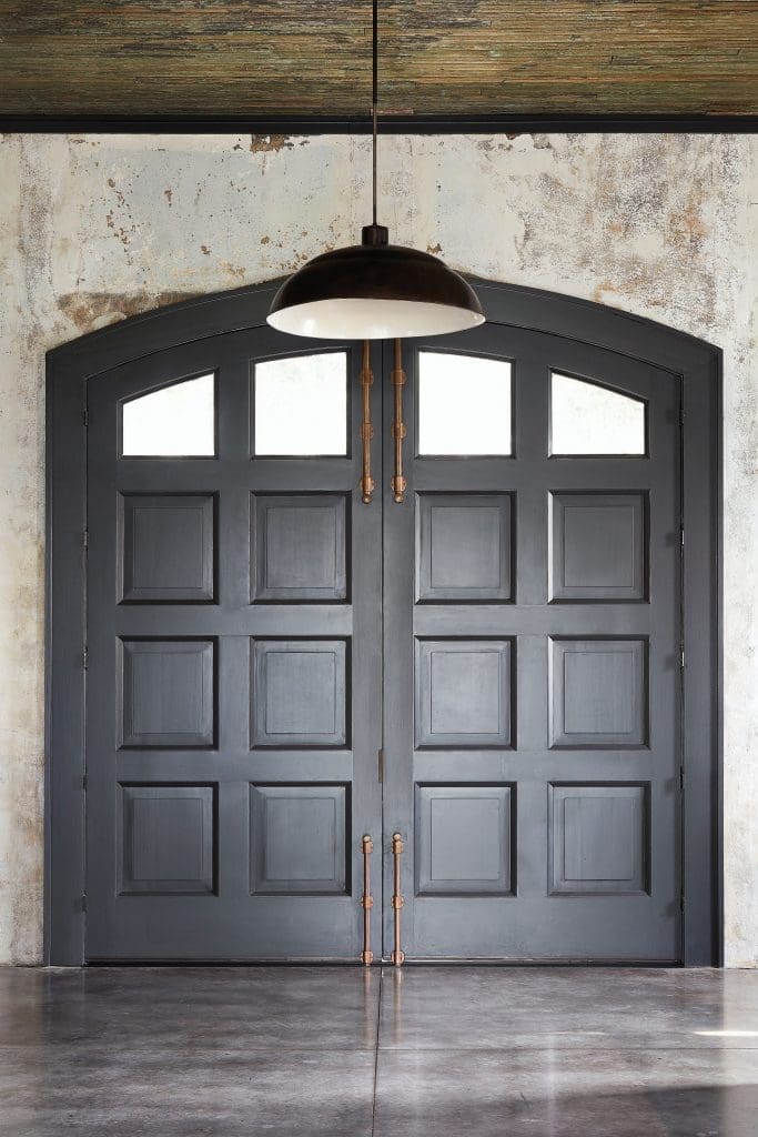 Custom doors inspired by vintage doors at the Houston Fire Museum. Vintage lighting, circa 1910. 