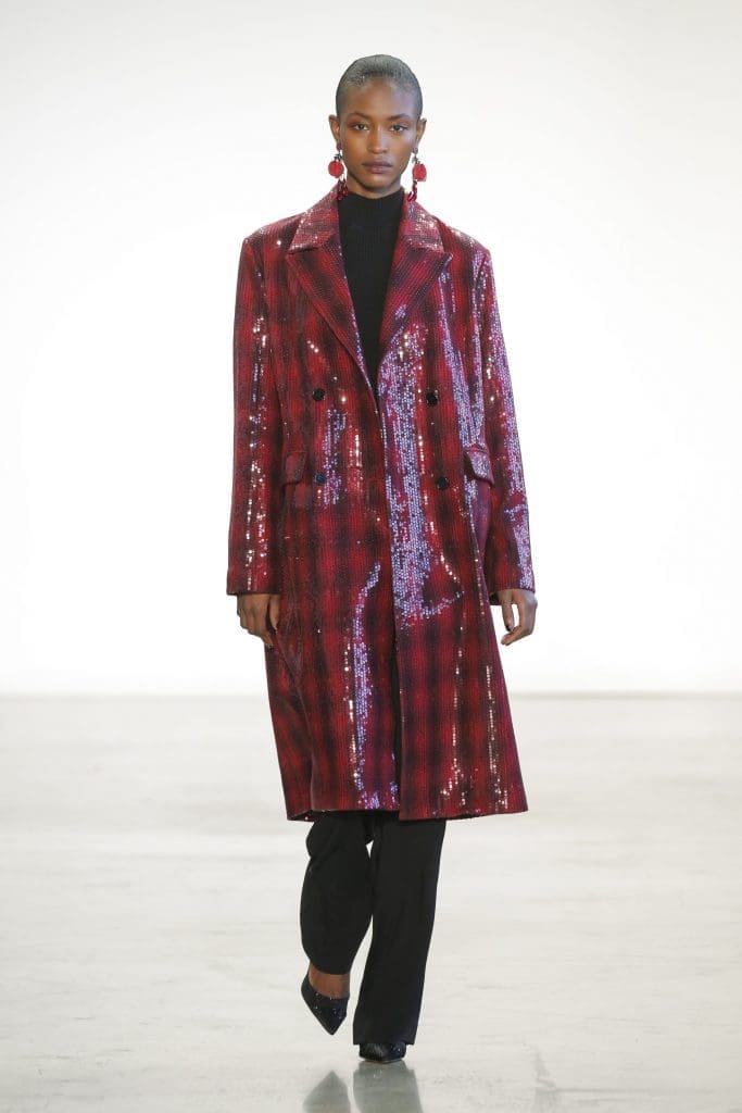 Badgley Mischka ruby/ebony sequined plaid wool coat, ebony cashmere turtleneck, and ebony crepe pant.