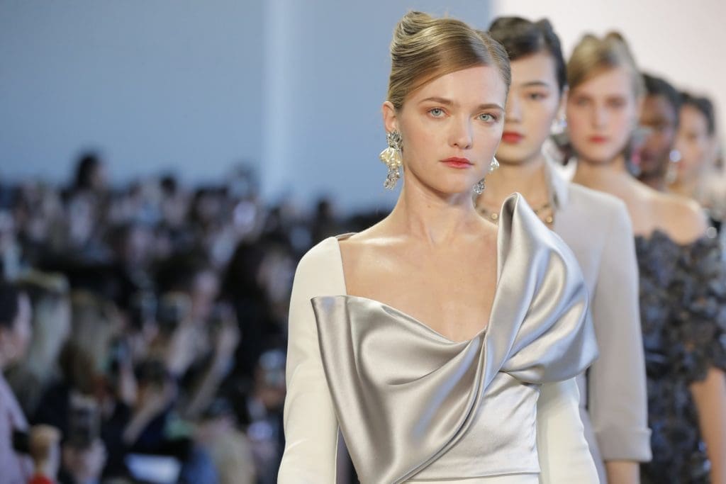 Badgley Mischka white crepe and dove satin bow gown. 
