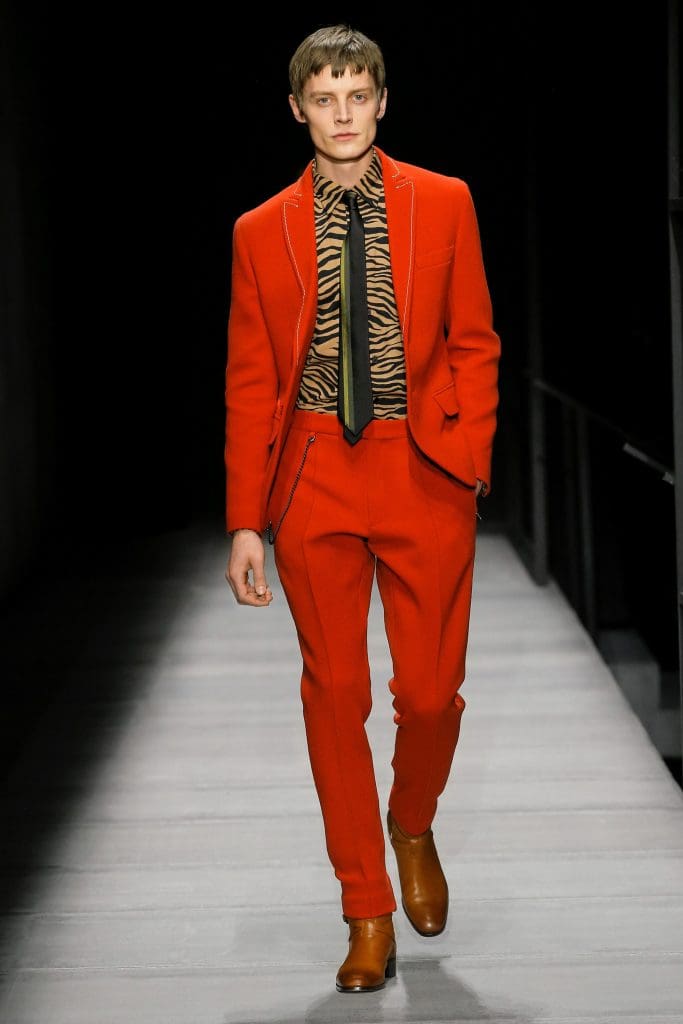 Bottega Veneta men's red suit, tiger print shirt, and black leather tie.