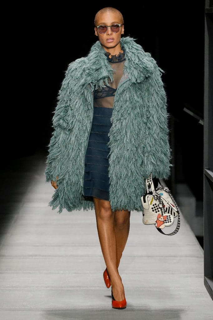Bottega Veneta teal wooly coat, navy dress with illusion bodice.