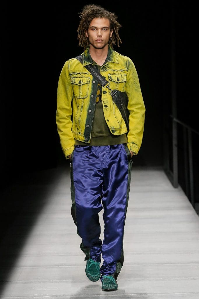 Bottega Veneta shiny satin pants, acid green denim jacket, cross body bag.