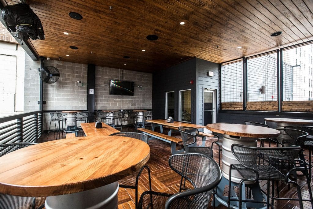 The covered roof deck gets an excellent view of the courtyard and drop down screen. 