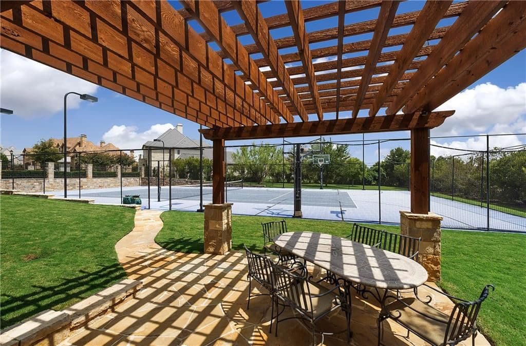 The property has a tennis court and cabana. 