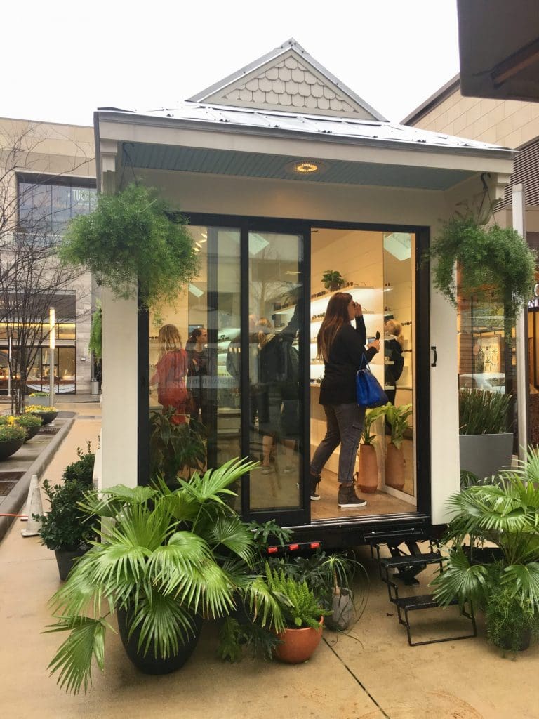 While it's less than 180 square feet, the KREWE Tiny House had plenty of room for shoppers to check out fun frames. 