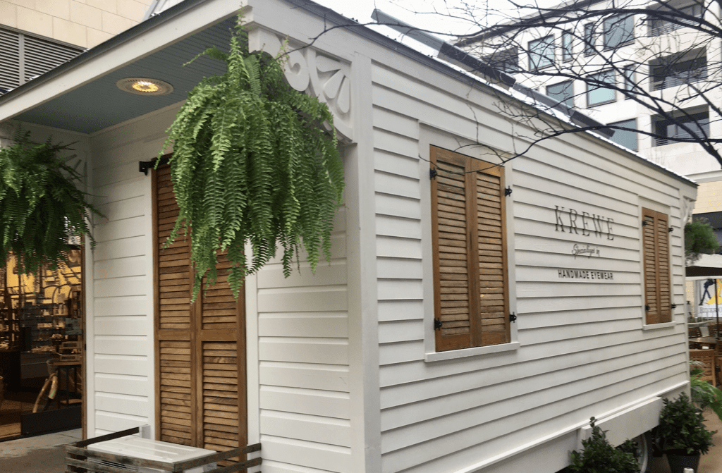The KREWE Tiny House even has shutters and greenery. 