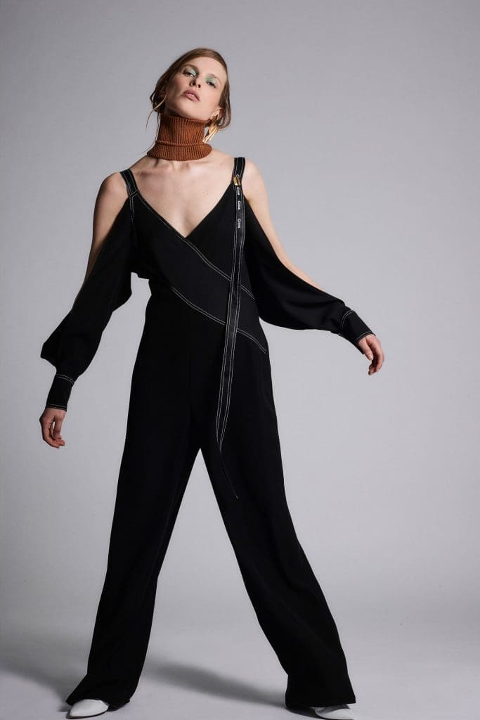 Yigal Azrouël black jumpsuit with cold shoulder sleeves.
