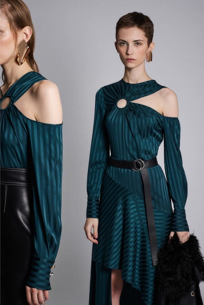 Yigal Azrouël  teal dress and blouse feature cold shoulder detail on one shoulder only.