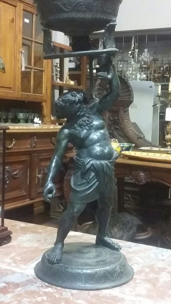 A Greco-Roman-inspired bronze of a drunken Silenus hints at Truxillo's ready wit and aptitude for entertainment. 