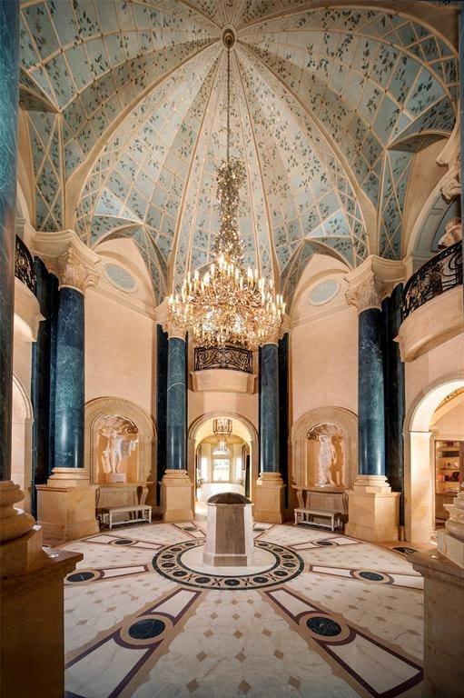 Dark blue marble accents complement this high ceiling in the 27,000 square foot  Chateau Cornarvon from which Marie Bosarge was ousted. 