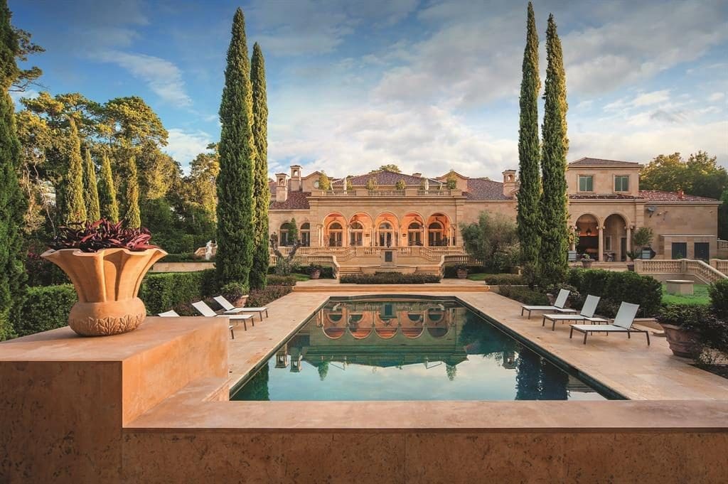The pool view of the 27,000 square foot Chateau Carnarvon that Marie and Ed Bosarge called home before his exit for a Russian socialite.